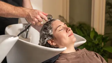 A woman getting her hair washed