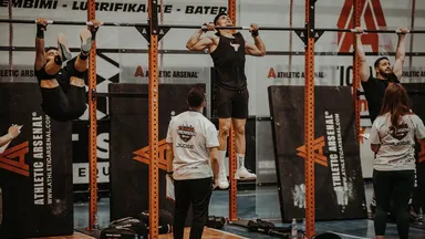 People doing pull ups at the gym