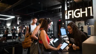 Clients checking in at the gym