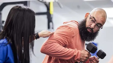 A man training with his personal trainer