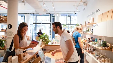A customer checking out at the front desk