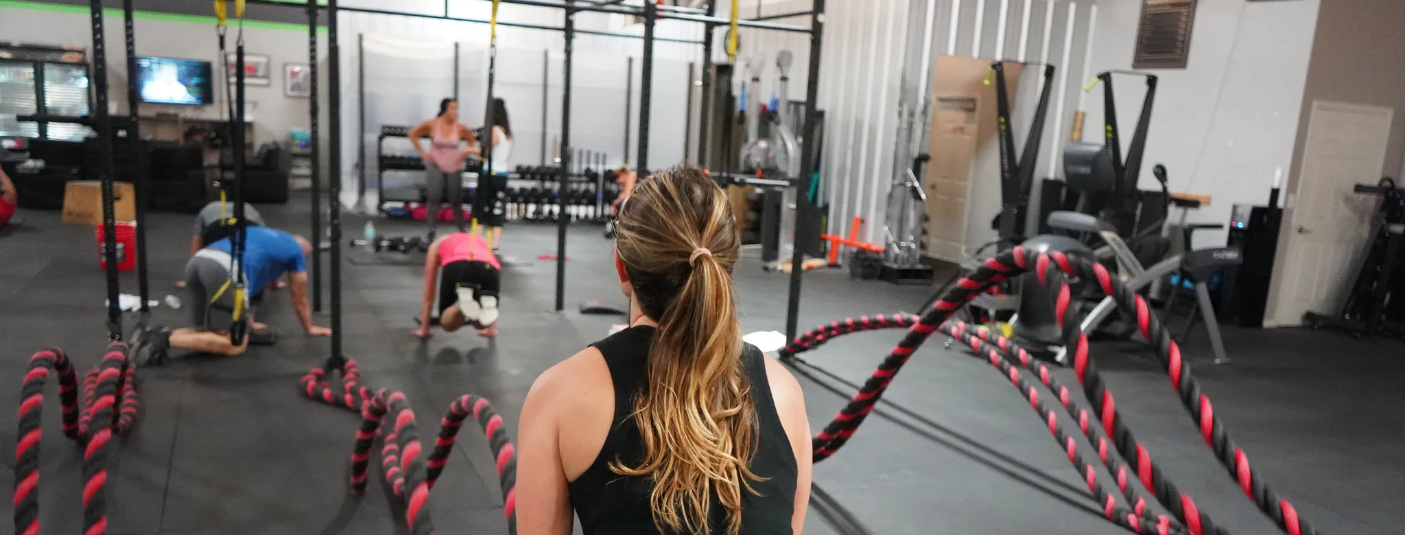 Woman using battle ropes