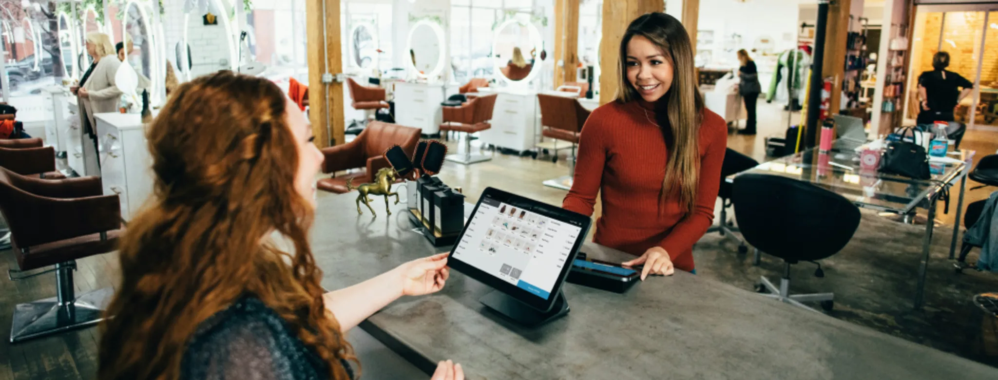 Woman checking in at hair salon