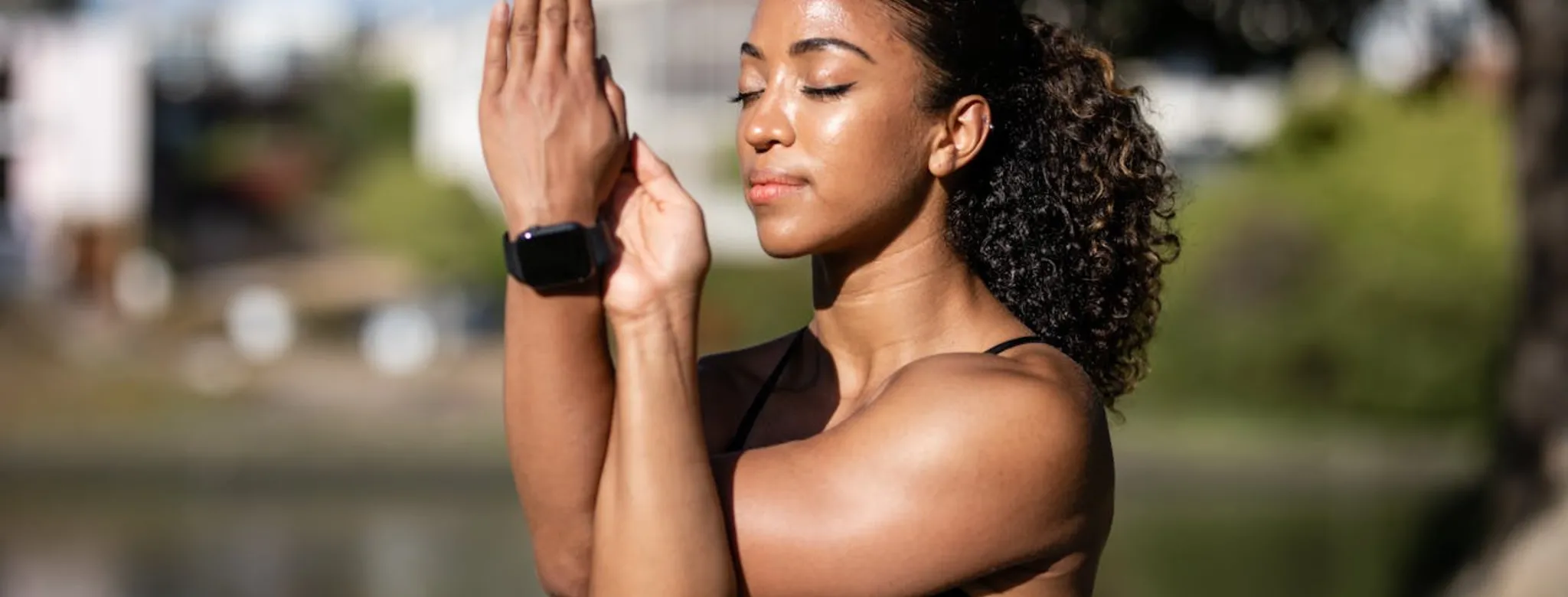 A woman performing breathwork exercises