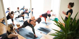 People in yoga class doing poses