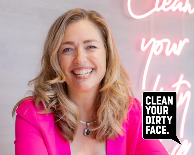 The owner of Clean Your Dirty Face in her studio